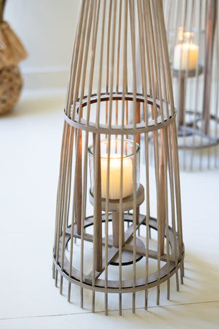 SET OF THREE GREY RATTAN LANTERNS WITH GLASS INSERTS