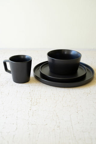 SET OF FOUR BLACK CERAMIC MUGS