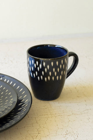 SET OF FOUR BLUE AND WHITE CERAMIC MUGS