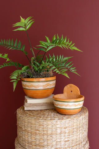 SET OF THREE PAINTED TERRACOTTA WALL PLANTERS