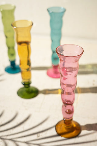 SET OF FOUR GLASS TRUMPET VESSELS - ONE EACH COLOR