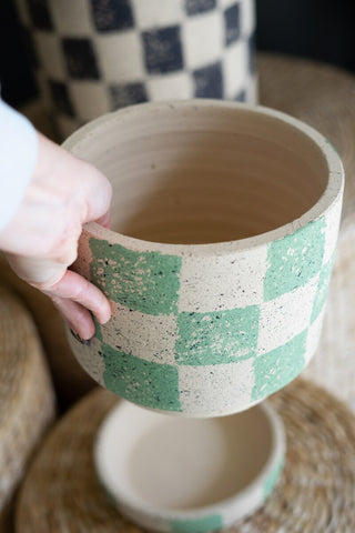 SET OF THREE CHECKERED CLAY PLANTERS WITH TRAYS