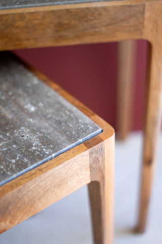 SET 2 NESTING MANGO WOOD ACCENT TABLES W TITANIUM TRAVERTINE TOPS