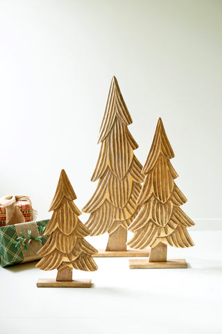 SET OF THREE CARVED WOODEN CHRISTMAS TREES ON BASES - NATURAL WITH GOLD DETAIL