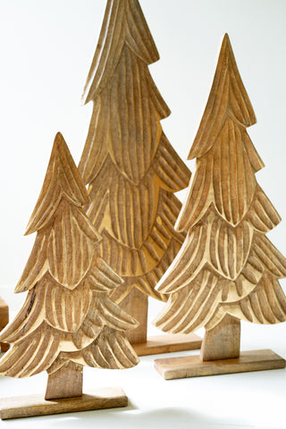 SET OF THREE CARVED WOODEN CHRISTMAS TREES ON BASES - NATURAL WITH GOLD DETAIL