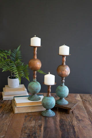 SET OF THREE COPPER PATINA FINISH PILLAR CANDLE HOLDERS