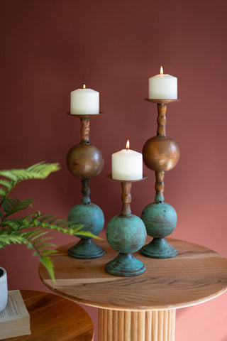 SET OF THREE COPPER PATINA FINISH PILLAR CANDLE HOLDERS