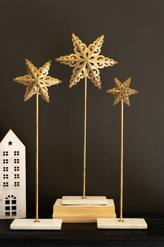 SET OF THREE METAL STARS ON MARBLE BASES