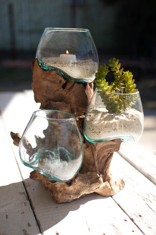 THREE BLOWN GLASS BOWLS ON A DRIFTWOOD BASE