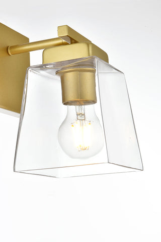 Merrick 1 light Brass and Clear Bath Sconce