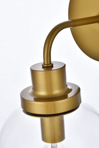 Hanson 1 light bath sconce in brass with clear shade