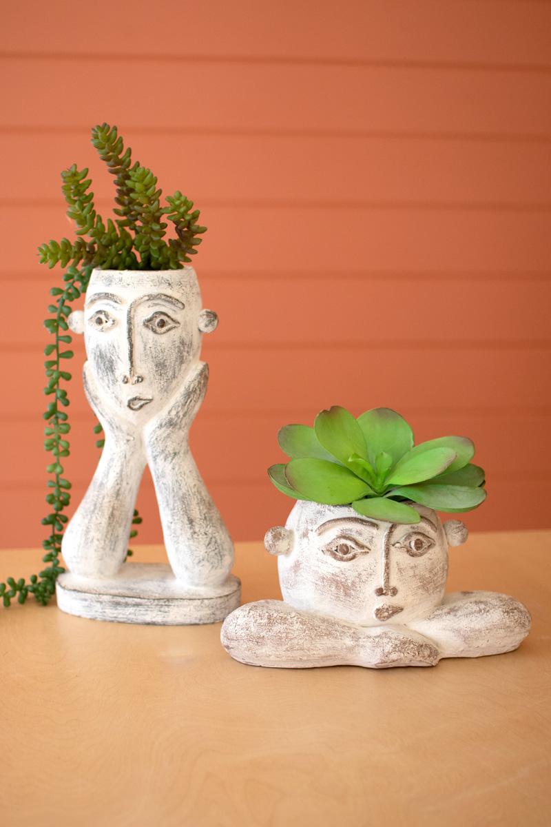 SET OF TWO PAINTED RESIN FACE PLANTERS