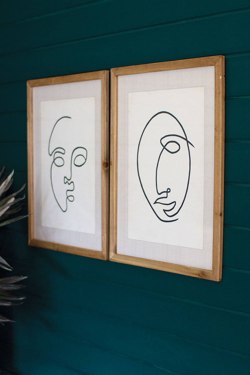 SET OF TWO FACE PRINTS UNDER GLASS